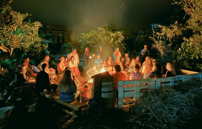 People surrounding a bonfire